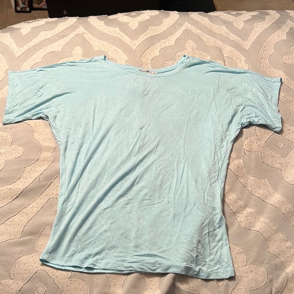 Loose chest and sleeves with a more fitted waist